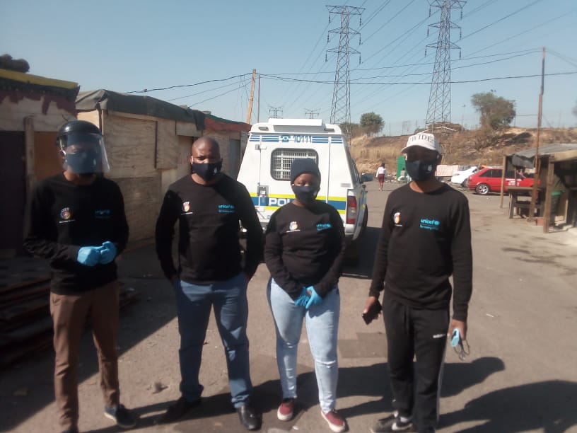 Afrika Tikkun workers in a township area.