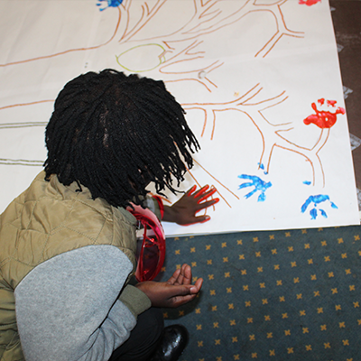 A child hand painting.